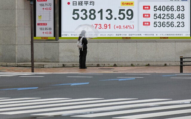 A person looks at an electronic stock board showing Japan's Nikkei index at a securities firm Thursday, April 2, 2026, in Tokyo. (AP Photo/Eugene Hoshiko) A person looks at an electronic stock board showing Japan's Nikkei index at a securities firm Thursday, April 2, 2026, in Tokyo. (AP Photo/Eugene Hoshiko)