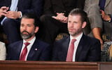 Donald Trump Jr., left, and Eric Trump listen to US President Donald Trump's State of the Union address at the US Capitol in Washington, February 24, 2026. (AP Photo/Alex Brandon)