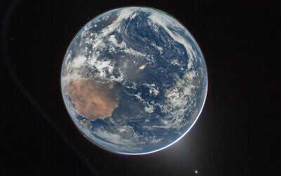 This image provided by NASA shows a view of Earth taken by Artemis II Commander Reid Wiseman from the Orion spacecraft's window after completing the translunar injection burn on April 2, 2026. (NASA via AP) This image provided by NASA shows a view of Earth taken by Artemis II Commander Reid Wiseman from the Orion spacecraft's window after completing the translunar injection burn on April 2, 2026. (NASA via AP)