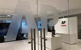 The Associated Press logo is shown at the entrance to the news organization's office in New York, July 13, 2023. (AP Photo/Aaron Jackson, File)