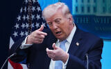US President Donald Trump pretends to aim a sniper gun while speaking with reporters in the James Brady Press Briefing Room at the White House, April 6, 2026, in Washington. (AP/Julia Demaree Nikhinson)