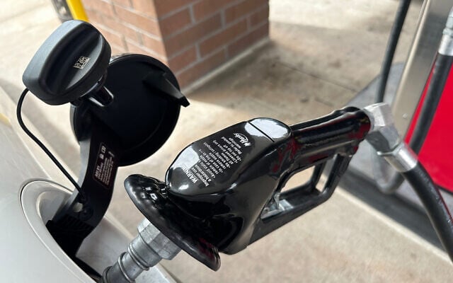 A motorist fills up the tank of a vehicle at a gasoline station, April 6, 2026, in Greenwood Village, Colorado (AP Photo/David Zalubowski)