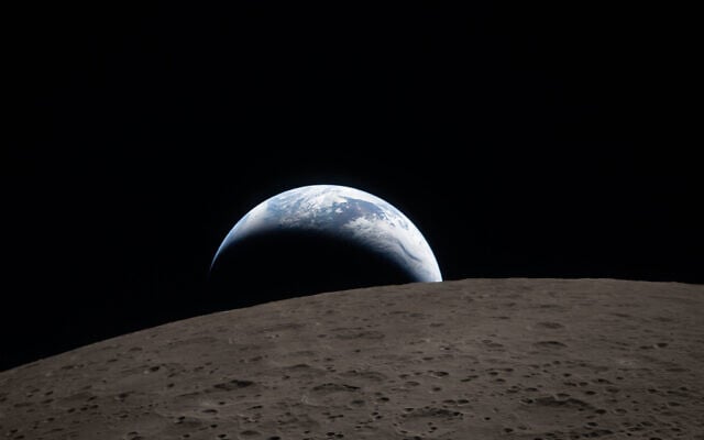 In this image provided by NASA, The Artemis II crew captured this view of an Earthset on April 6, 2026, as they flew around the Moon. (NASA via AP)