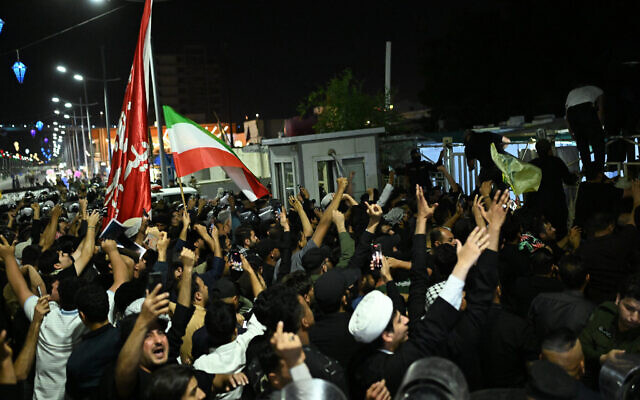 A group of Iraqi protesters storms the Kuwaiti Consulate and removes the Kuwaiti national flag from the building, in Basra, Iraq, April 8, 2026. (AP/Ali Rahim) A group of Iraqi protesters storms the Kuwaiti Consulate and removes the Kuwaiti national flag from the building, in Basra, Iraq, April 8, 2026. (AP/Ali Rahim)