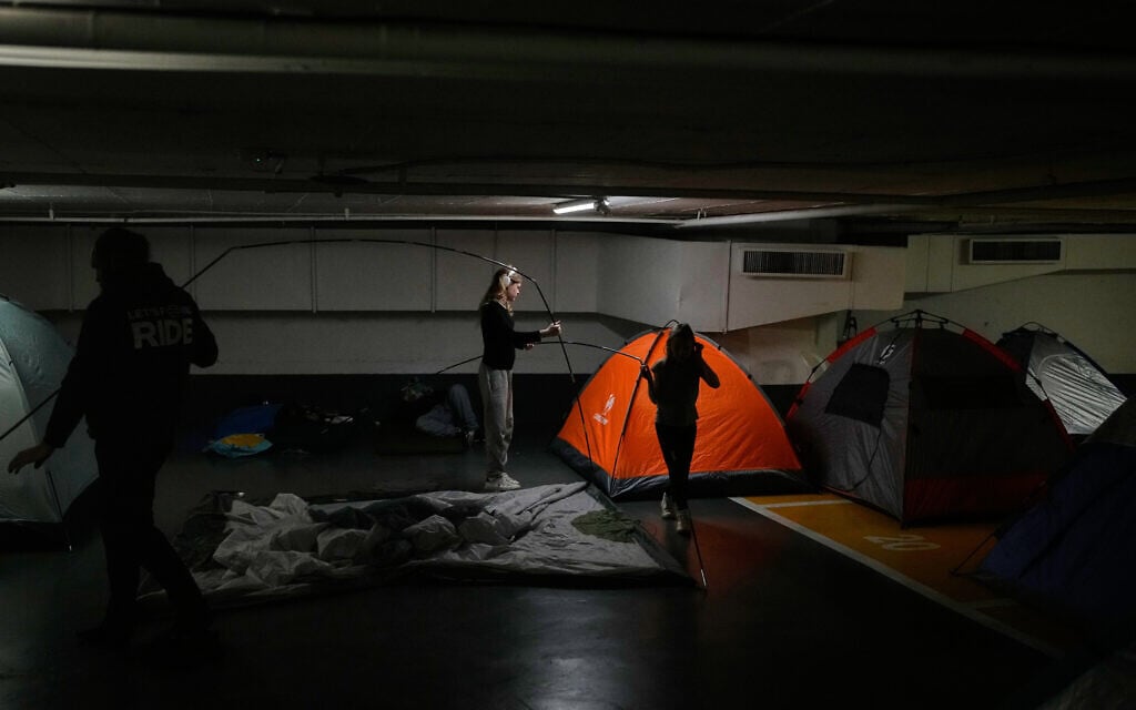 Members of the Morozov-Kosiak family dismantle their tent in an underground shelter where they had been staying during the war with Iran, after the announcement of a two-week ceasefire, in Tel Aviv, Wednesday, April 8, 2026. (AP Photo/Ohad Zwigenberg) Members of the Morozov-Kosiak family dismantle their tent in an underground shelter where they had been staying during the war with Iran, after the announcement of a two-week ceasefire, in Tel Aviv, Wednesday, April 8, 2026. (AP Photo/Ohad Zwigenberg)