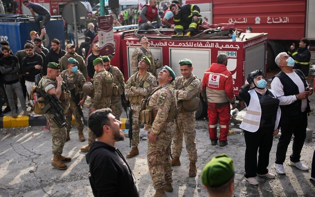 Lebanese army soldiers and first responders look up at an Israeli drone flying overhead at the site of an Israeli airstrike in Beirut, Lebanon, April 8, 2026. (AP Photo/Emilio Morenatti) Lebanese army soldiers and first responders look up at an Israeli drone flying overhead at the site of an Israeli airstrike in Beirut, Lebanon, April 8, 2026. (AP Photo/Emilio Morenatti)