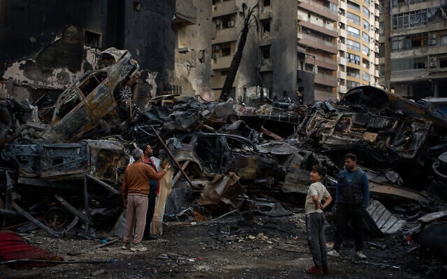 Residents gather near charred cars and buildings, at the site of Wednesday's Israeli airstrike, in Beirut, Lebanon, Friday, April 10, 2026. (AP Photo/Emilio Morenatti) Residents gather near charred cars and buildings, at the site of Wednesday's Israeli airstrike, in Beirut, Lebanon, Friday, April 10, 2026. (AP Photo/Emilio Morenatti)