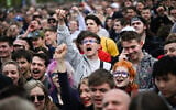 People react during an anti-government concert featuring dozens of the country's most popular performers in Budapest, Hungary, April 10, 2026. (AP Photo/Denes Erdos)
