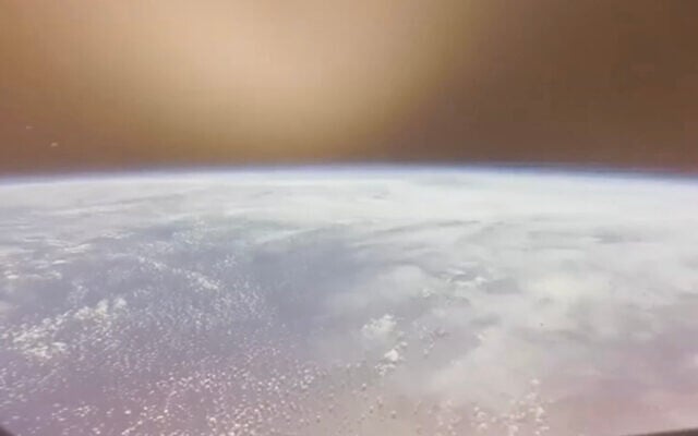In this image from video provided by NASA, the Earth is seen from the Artemis II Orion capsule as it enters the atmosphere for splashdown in the Pacific Ocean, on April 10, 2026. (NASA via AP)