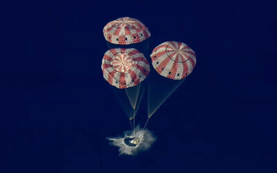 In this image from video provided by NASA, the Artemis II Orion capsule splashes down in the Pacific Ocean, on Friday, April 10, 2026. (NASA via AP) In this image from video provided by NASA, the Artemis II Orion capsule splashes down in the Pacific Ocean, on Friday, April 10, 2026. (NASA via AP)