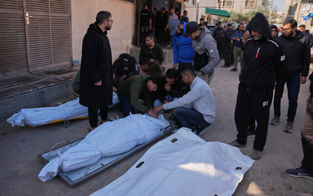 Palestinians mourn over the bodies of men killed in an Israeli strike in al-Bureij refugee camp, during their funeral outside at Al-Aqsa Hospital in Deir al-Balah, central Gaza Strip, April 11, 2026. (AP Photo/Abdel Kareem Hana) Palestinians mourn over the bodies of men killed in an Israeli strike in al-Bureij refugee camp, during their funeral outside at Al-Aqsa Hospital in Deir al-Balah, central Gaza Strip, April 11, 2026. (AP Photo/Abdel Kareem Hana)