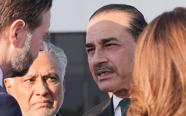 Pakistan's Chief of Defence Forces and Chief of Army Staff Field Marshall Asim Munir, right, talks to Vice President JD Vance as Pakistani Deputy Prime Minister and Foreign Minister Mohammad Ishaq Dar, left, listens before Vance boards Air Force Two after attending talks on Iran in Islamabad, Pakistan, Sunday, April 12, 2026. (AP Photo/Jacquelyn Martin, Pool)