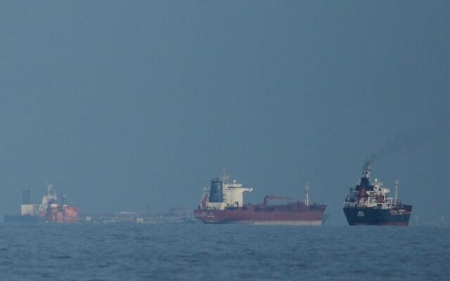 Oil tankers and cargo ships line up in the Strait of Hormuz as seen from Khor Fakkan, United Arab Emirates, March 11, 2026. (AP/Altaf Qadri,File)