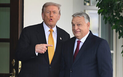 US President Donald Trump, left, greets Hungary's Prime Minister Viktor Orban at the White House, Nov. 7, 2025, in Washington. (AP Photo/John McDonnell, File)