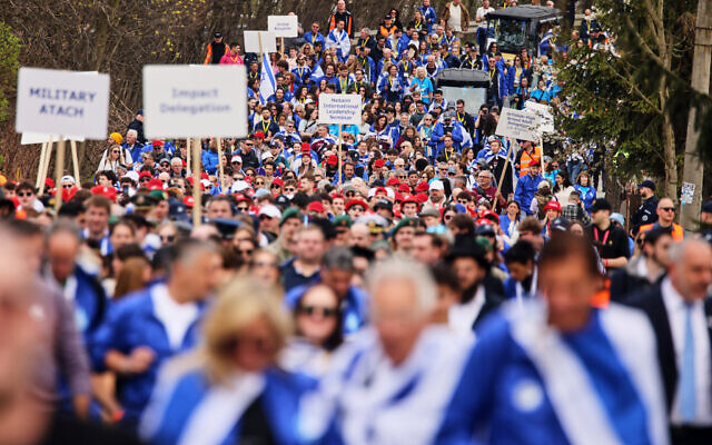 People take part in the annual 'March of the Living' to commemorate the Holocaust, a yearly Holocaust remembrance march between the former death camps of Auschwitz and Birkenau, in Oswiecim, Poland, April 14, 2026. (AP/Beata Zawrzel)