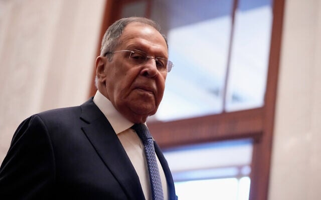 Russia's Foreign Minister Sergey Lavrov walks for a meeting with China's President Xi Jinping, at the Great Hall of the People in Beijing, China Wednesday, April 15, 2026. (Iori Sagisawa/Pool Photo via AP)