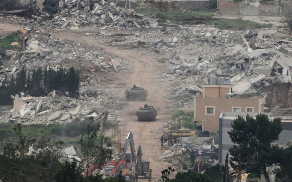Israeli army vehicles and bulldozers operating in southern Lebanon, as seen from northern Israel, April 15, 2026. (AP Photo/Ariel Schalit)