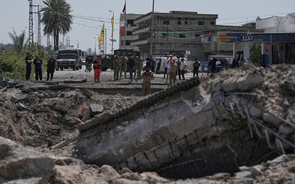 Lebanese soldiers check a destroyed bridge that was hit in an Israeli airstrike in Qasmiyeh near the coastal city of Tyre, south Lebanon, Thursday, April 16, 2026. (AP Photo/Mohammed Zaatari)