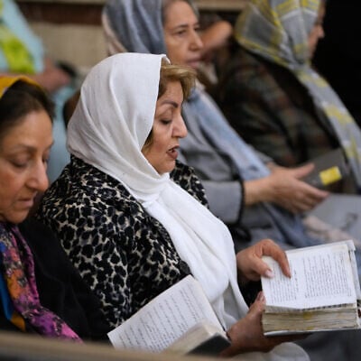Iranian Jews pray in a memorial for the slain Iranian supreme leader Ayatollah Ali Khamenei and other victims, who were killed in the US and Israel strikes, at Yousefabad Synagogue, in Tehran, Iran, on April 16, 2026. (AP Photo/Vahid Salemi)