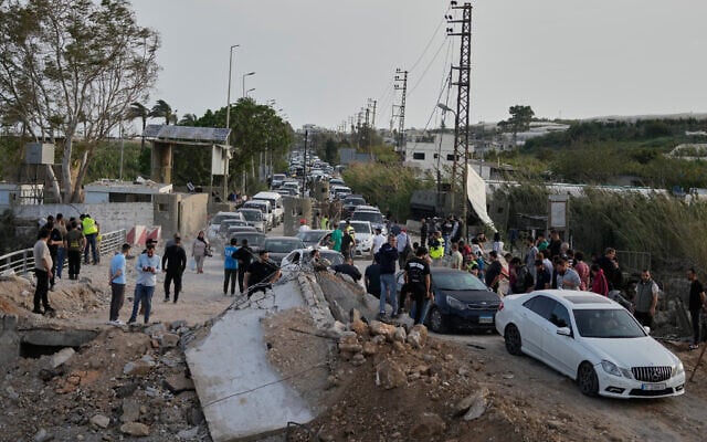 Displaced people returning to their villages following a ceasefire between Hezbollah and Israel cross the damaged Qasmiyeh bridge near Tyre, south Lebanon, April 17, 2026. (AP/Mohammed Zaatari) Displaced people returning to their villages following a ceasefire between Hezbollah and Israel cross the damaged Qasmiyeh bridge near Tyre, south Lebanon, April 17, 2026. (AP/Mohammed Zaatari)