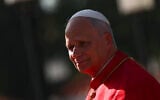 Pope Leo XIV arrives at the Presidential Palace for his meeting with Angola's President Joao Lourenco in Luanda, Angola, April 18, 2026. (Guglielmo Mangiapane/Pool Photo via AP)