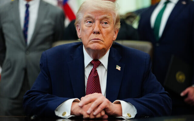 US President Donald Trump listens in the Oval Office of the White House, Saturday, April 18, 2026, in Washington. (AP Photo/Julia Demaree Nikhinson)