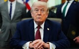 US President Donald Trump listens in the Oval Office of the White House in Washington, April 18, 2026. (Julia Demaree Nikhinson/ AP)
