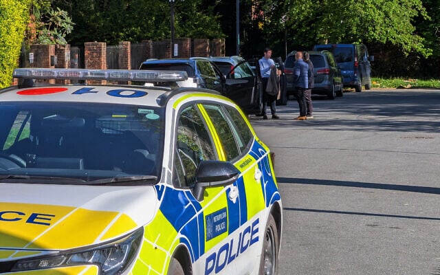 Police officers patrol at a cordon near Kenton United Synagogue in Harrow, a suburb of London, April 19, 2026. (Jamie Lashmar/PA via AP) Police officers patrol at a cordon near Kenton United Synagogue in Harrow, a suburb of London, April 19, 2026. (Jamie Lashmar/PA via AP)