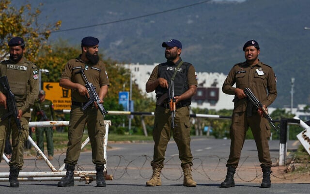 Police officers stand guard at a checkpoint to ensure security ahead of the second round of negotiations between the US and Iran, in Islamabad, Pakistan, April 20, 2026. (AP Photo/Anjum Naveed)