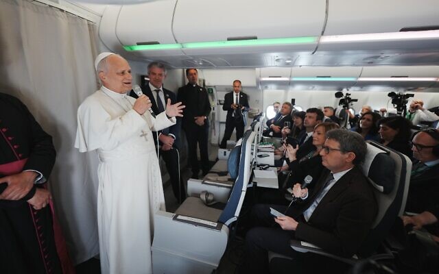 Pope Leo XIV speaks to journalists aboard the papal flight from Malabo to Rome, April 23, 2026, at the end of his 11-day pastoral visit to Africa. (AP Photo/Andrew Medichini, Pool) Pope Leo XIV speaks to journalists aboard the papal flight from Malabo to Rome, April 23, 2026, at the end of his 11-day pastoral visit to Africa. (AP Photo/Andrew Medichini, Pool)