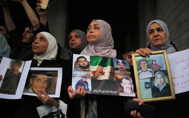 Relatives of victims demand the execution of Amjad Yousef, a former intelligence officer allegedly linked to their killings, after the Interior Ministry announced his arrest, in the Tadamon neighborhood of Damascus, Syria, April 24, 2026. (AP Photo/Omar Albam) Relatives of victims demand the execution of Amjad Yousef, a former intelligence officer allegedly linked to their killings, after the Interior Ministry announced his arrest, in the Tadamon neighborhood of Damascus, Syria, April 24, 2026. (AP Photo/Omar Albam)