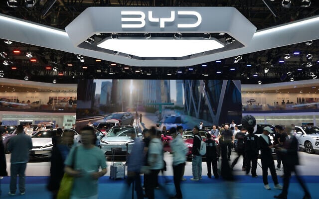 Visitors tour Chinese automaker BYD's booth with a screen showing its battery charging station under sub-zero temperatures, at the Auto China 2026 show in Beijing, April 25, 2026. (AP/Andy Wong) Visitors tour Chinese automaker BYD's booth with a screen showing its battery charging station under sub-zero temperatures, at the Auto China 2026 show in Beijing, April 25, 2026. (AP/Andy Wong)