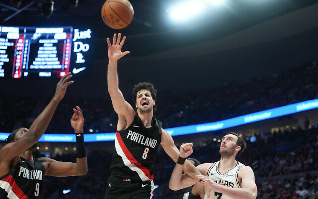 Portland Trail Blazers forward Deni Avdija (8) goes for the ball as San Antonio Spurs center/forward Luke Kornet (7) looks on during the first half in Game 4 of a first-round NBA basketball playoffs series in Portland, Oregon, April 26, 2026. (AP Photo/Jenny Kane) Portland Trail Blazers forward Deni Avdija (8) goes for the ball as San Antonio Spurs center/forward Luke Kornet (7) looks on during the first half in Game 4 of a first-round NBA basketball playoffs series in Portland, Oregon, April 26, 2026. (AP Photo/Jenny Kane)