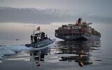Illustrative: In this photo released by Tasnim News Agency, a Revolutionary Guard Navy (IRGC) speedboat approaches the cargo ship Epaminondas during what state media described as the seizure of one of two vessels accused of violations in the Strait of Hormuz, April 21, 2026. (Meysam Mirzadeh/Tasnim News Agency via AP, File)
