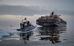 Illustrative: In this photo released by Tasnim News Agency, a Revolutionary Guard Navy (IRGC) speedboat approaches the cargo ship Epaminondas during what state media described as the seizure of one of two vessels accused of violations in the Strait of Hormuz, April 21, 2026. (Meysam Mirzadeh/Tasnim News Agency via AP, File)