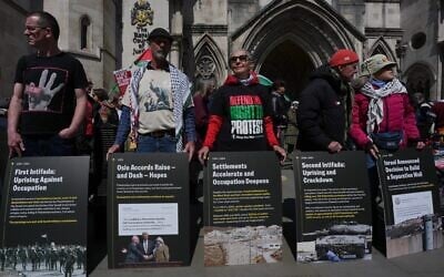 Supporters of Palestine Action stage a protest outside the Royal Court of Justice in London, April 28, 2026. (AP Photo/Kin Cheung)