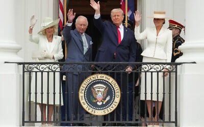 Left to right: British Queen Camilla ajd King Charles III, and US President Donald Trump and first lady Melania Trump, wave from the Blue Room Balcony during a State Visit arrival ceremony on the South Lawn of the White House, on April 28, 2026, in Washington. (AP Photo/Alex Brandon)