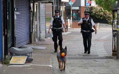 Police officers patrol the high street after two people were stabbed in Golders Green neighborhood, that has a large Jewish community, in London, April 29, 2026. (AP Photo/Kin Cheung) Police officers patrol the high street after two people were stabbed in Golders Green neighborhood, that has a large Jewish community, in London, April 29, 2026. (AP Photo/Kin Cheung)