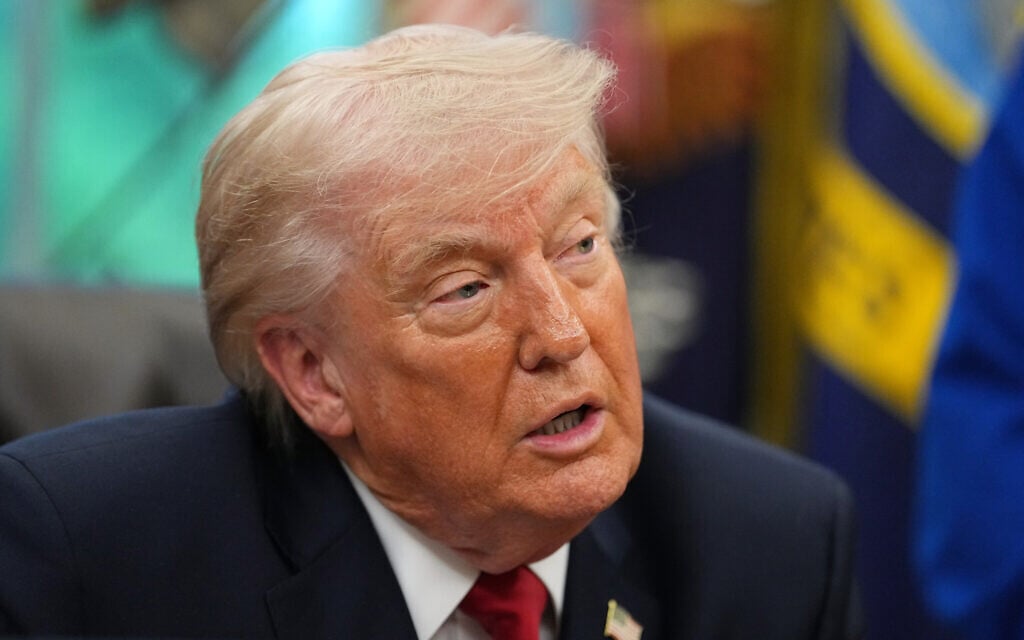 US President Donald Trump speaks to reporters as he meets with NASA's Artemis II astronauts Victor Glover, Christina Koch, Reid Wiseman and Jeremy Hansen in the Oval Office of the White House, April 29, 2026, in Washington. (AP Photo/Matt Rourke)