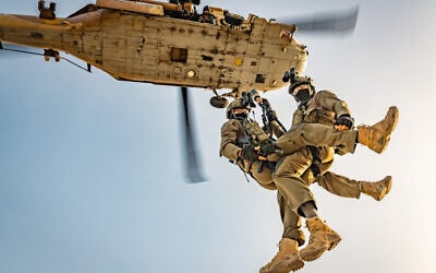 Soldiers from the IDF's Unit 669 rappelling from a helicopter. (Amit Agronov)