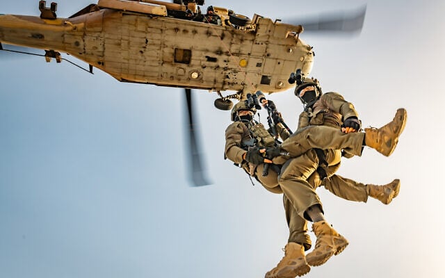 Soldiers from the IDF's Unit 669 rappelling from a helicopter. (Amit Agronov)