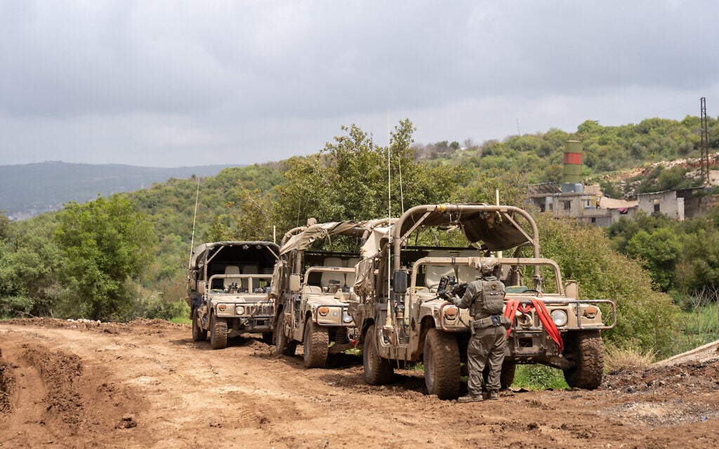Israeli troops and Humvees are seen near the southern Lebanon village of Ayta ash-Shab, April 19, 2026. (Emanuel Fabian/Times of Israel)