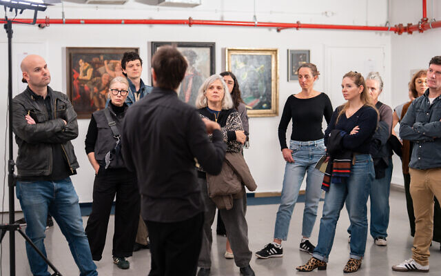 Small groups touring through the basement rooms of the Tel Aviv Museum of Art, seeing works from 'End of the Day: One Hundred Years of the New Objectivity Movement' during April 2026 (Daniel Hanoch) Small groups touring through the basement rooms of the Tel Aviv Museum of Art, seeing works from 'End of the Day: One Hundred Years of the New Objectivity Movement' during April 2026 (Daniel Hanoch)
