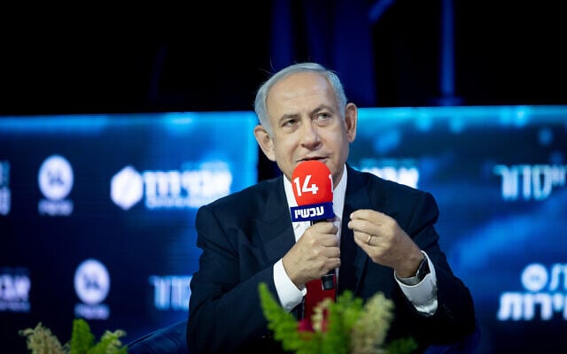 Then-leader of the opposition Benjamin Netanyahu speaks at a Channel 14 conference in Jerusalem, October 23, 2022. (Yonatan SIndel/Flash90) Then-leader of the opposition Benjamin Netanyahu speaks at a Channel 14 conference in Jerusalem, October 23, 2022. (Yonatan SIndel/Flash90)