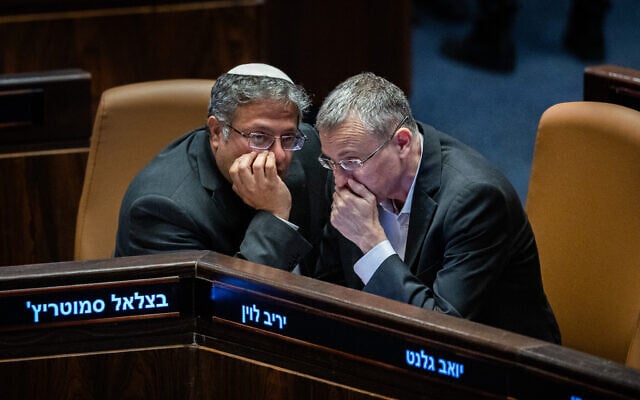 Justice Minister Yariv Levin and National Security Minister Itamar Ben Gvir talk at the Knesset in Jerusalem on September 29, 2024 (Yonatan Sindel/Flash90)