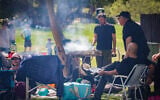 File: People barbecue during Passover in Herzliya, April 13, 2025 (Tal Gal/Flash90)