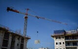 Workers are seen at a construction site in Katzrin, in the Golan Heights, January 6, 2025. (Michael Giladi/Flash90)