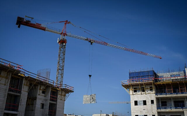 Workers are seen at a construction site in Katzrin, in the Golan Heights, January 6, 2025. (Michael Giladi/Flash90) Workers are seen at a construction site in Katzrin, in the Golan Heights, January 6, 2025. (Michael Giladi/Flash90)
