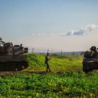 IDF soldiers at a staging area near the Israeli border with Syria, February 28, 2026. (Michael Giladi/Flash90)