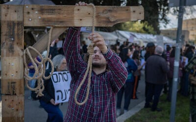 Activists protest against a law passed by the Knesset imposing the death penalty outside the Knesset in Jerusalem, March 31, 2026. (Chaim Goldberg/Flash90)
